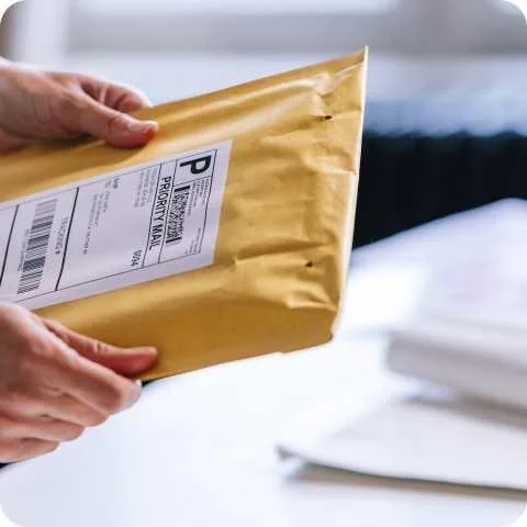 Prepaid priority mail envelope with shipping label